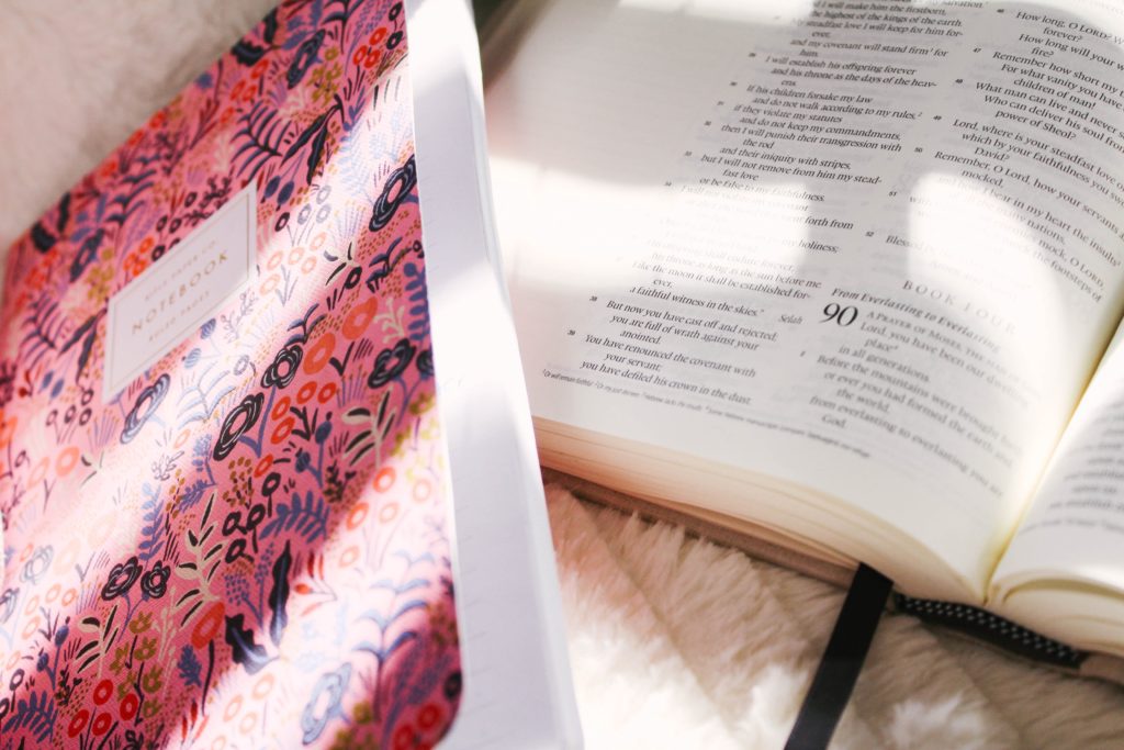 Bible and pink notebook